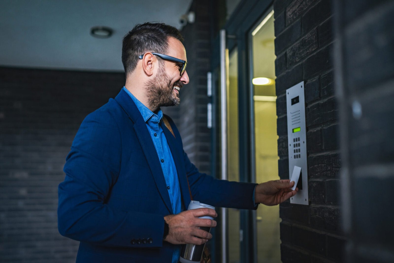 A man using a commercial security system for office access.